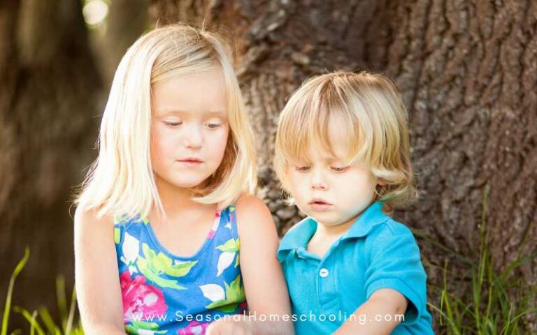 kids reading under a tree